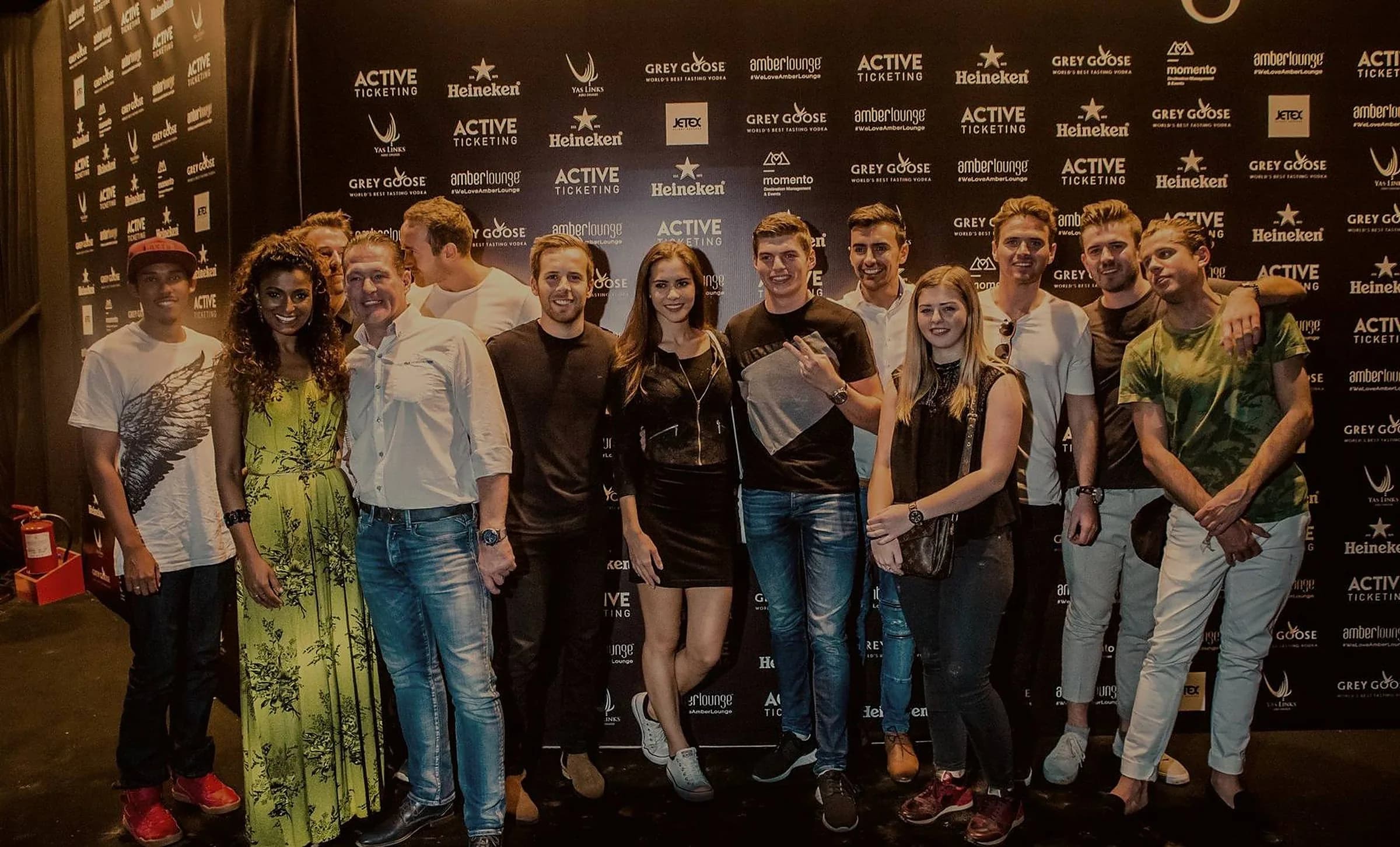 Racing drivers on the Amber Lounge Fashion Show catwalk